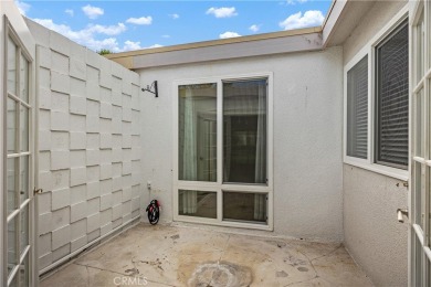 Sun-splashed Barcelona end unit with leafy outlooks, a private on Laguna Woods Village Golf Course in California - for sale on GolfHomes.com, golf home, golf lot