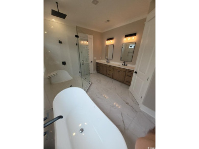 Check out the private wooded view of this immensely grand home! on Myrtlewood Golf Course and Club  in South Carolina - for sale on GolfHomes.com, golf home, golf lot