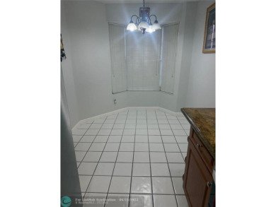Well maintained and very spacious 3/2.5 townhome in Woodmont on  in Florida - for sale on GolfHomes.com, golf home, golf lot