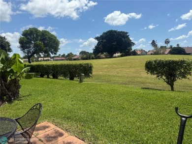 Well maintained and very spacious 3/2.5 townhome in Woodmont on  in Florida - for sale on GolfHomes.com, golf home, golf lot