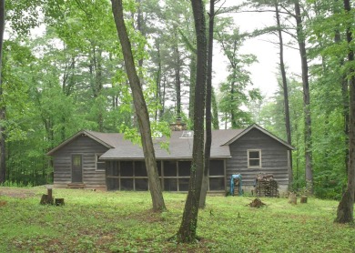 3 bedroom cabin on 4 beautiful wooded lots totaling 1.88 acres on Hide-A-Way Hills Club in Ohio - for sale on GolfHomes.com, golf home, golf lot