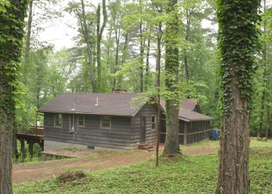 3 bedroom cabin on 4 beautiful wooded lots totaling 1.88 acres on Hide-A-Way Hills Club in Ohio - for sale on GolfHomes.com, golf home, golf lot