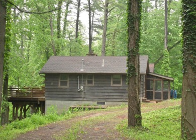 3 bedroom cabin on 4 beautiful wooded lots totaling 1.88 acres on Hide-A-Way Hills Club in Ohio - for sale on GolfHomes.com, golf home, golf lot