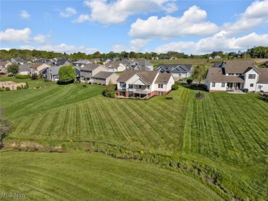 Enjoy your own slice of paradise! This beautiful 4 bedroom, 3 on The Legends of Massillon in Ohio - for sale on GolfHomes.com, golf home, golf lot