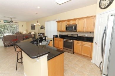 Nestled within tree-lined streets and mature landscaping in the on Victoria Hills Golf Club in Florida - for sale on GolfHomes.com, golf home, golf lot
