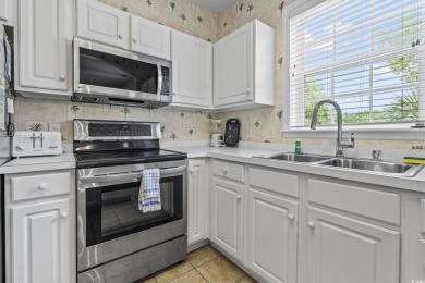 Enjoy resort-style living in this fully furnished 2-bedroom on Barefoot Resort and Golf Club  in South Carolina - for sale on GolfHomes.com, golf home, golf lot