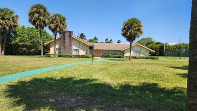Stunningly renovated and rarely available, this spacious on Lakeview Golf Club in Florida - for sale on GolfHomes.com, golf home, golf lot