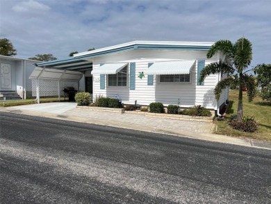 Welcome to this delightful, fully furnished, two-bedroom on Palm Hill Golf Club in Florida - for sale on GolfHomes.com, golf home, golf lot