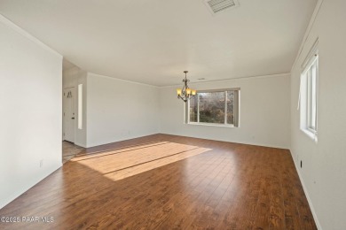 This warm and welcoming home is located in a  highly sought on Prescott Golf and Country Club in Arizona - for sale on GolfHomes.com, golf home, golf lot