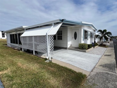 Welcome to this delightful, fully furnished, two-bedroom on Palm Hill Golf Club in Florida - for sale on GolfHomes.com, golf home, golf lot