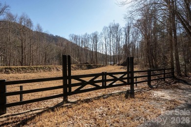Come see this pretty, sloping lot with distant lake views on Rumbling Bald Resort on Lake Lure in North Carolina - for sale on GolfHomes.com, golf home, golf lot
