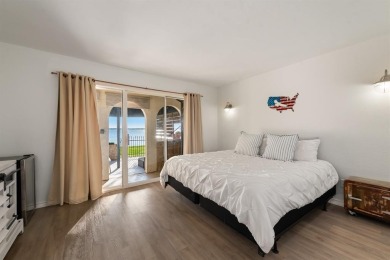 Stunning WATERFRONT townhome in a Mediterranean Style, gated on Lakeside Village Golf Course in Texas - for sale on GolfHomes.com, golf home, golf lot