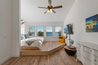 Stunning WATERFRONT townhome in a Mediterranean Style, gated on Lakeside Village Golf Course in Texas - for sale on GolfHomes.com, golf home, golf lot