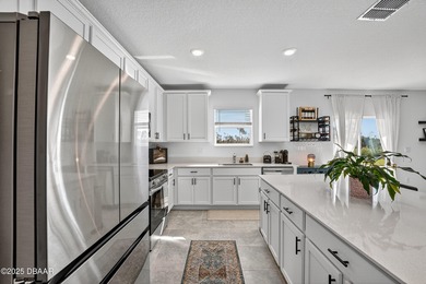 Welcome to this stunning 4-bedroom, 2.5-bath single-family home on LPGA International Golf Course in Florida - for sale on GolfHomes.com, golf home, golf lot