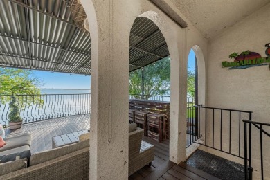 Stunning WATERFRONT townhome in a Mediterranean Style, gated on Lakeside Village Golf Course in Texas - for sale on GolfHomes.com, golf home, golf lot