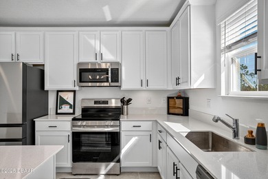 Welcome to this stunning 4-bedroom, 2.5-bath single-family home on LPGA International Golf Course in Florida - for sale on GolfHomes.com, golf home, golf lot