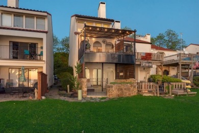 Stunning WATERFRONT townhome in a Mediterranean Style, gated on Lakeside Village Golf Course in Texas - for sale on GolfHomes.com, golf home, golf lot