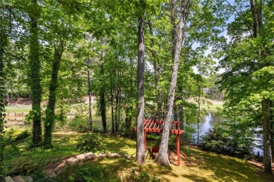 Fabulous retreat located in the heart of Towne Lake that offers on Canongate At Eagle Watch Golf Club in Georgia - for sale on GolfHomes.com, golf home, golf lot
