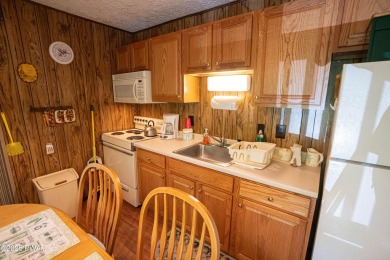 Welcome to this classic Pocono lake chalet, nestled in the heart on The Hideout Golf in Pennsylvania - for sale on GolfHomes.com, golf home, golf lot