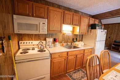 Welcome to this classic Pocono lake chalet, nestled in the heart on The Hideout Golf in Pennsylvania - for sale on GolfHomes.com, golf home, golf lot