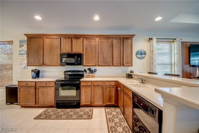 Welcome to this beautifully maintained lakefront home offering on Royal Tee Country Club in Florida - for sale on GolfHomes.com, golf home, golf lot