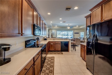 Welcome to this beautifully maintained lakefront home offering on Royal Tee Country Club in Florida - for sale on GolfHomes.com, golf home, golf lot