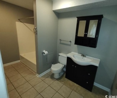 Two Bedroom, one and one half bath unit across the street from on The Hackler Course at Coastal Carolina University in South Carolina - for sale on GolfHomes.com, golf home, golf lot