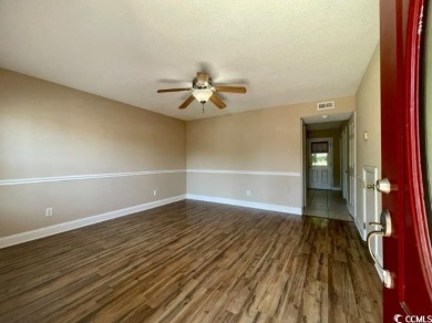 Two Bedroom, one and one half bath unit across the street from on The Hackler Course at Coastal Carolina University in South Carolina - for sale on GolfHomes.com, golf home, golf lot