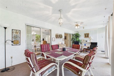 Welcome to this charming and spacious 2-bedroom, 2-bath end-unit on Palm Aire Country Club of Sarasota in Florida - for sale on GolfHomes.com, golf home, golf lot