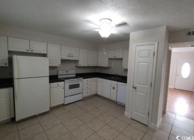 Two Bedroom, one and one half bath unit across the street from on The Hackler Course at Coastal Carolina University in South Carolina - for sale on GolfHomes.com, golf home, golf lot