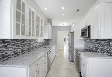 Beautiful 3/2/2 pool home located on oversized lot on the golf on Meadowood Golf and Tennis Club in Florida - for sale on GolfHomes.com, golf home, golf lot