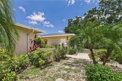 Welcome to this charming and spacious 2-bedroom, 2-bath end-unit on Palm Aire Country Club of Sarasota in Florida - for sale on GolfHomes.com, golf home, golf lot