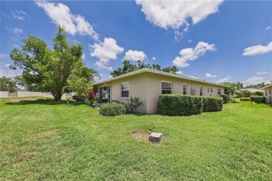 Welcome to this charming and spacious 2-bedroom, 2-bath end-unit on Palm Aire Country Club of Sarasota in Florida - for sale on GolfHomes.com, golf home, golf lot