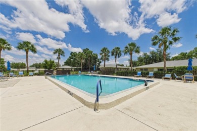 Welcome to this charming and spacious 2-bedroom, 2-bath end-unit on Palm Aire Country Club of Sarasota in Florida - for sale on GolfHomes.com, golf home, golf lot
