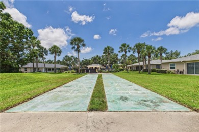 Welcome to this charming and spacious 2-bedroom, 2-bath end-unit on Palm Aire Country Club of Sarasota in Florida - for sale on GolfHomes.com, golf home, golf lot