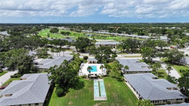 Welcome to this charming and spacious 2-bedroom, 2-bath end-unit on Palm Aire Country Club of Sarasota in Florida - for sale on GolfHomes.com, golf home, golf lot