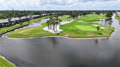 Welcome to this charming and spacious 2-bedroom, 2-bath end-unit on Palm Aire Country Club of Sarasota in Florida - for sale on GolfHomes.com, golf home, golf lot
