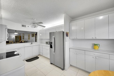 Step into this beautifully updated 55+ condo and immediately on Boca Dunes Golf and Country Club in Florida - for sale on GolfHomes.com, golf home, golf lot