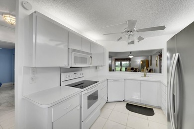 Step into this beautifully updated 55+ condo and immediately on Boca Dunes Golf and Country Club in Florida - for sale on GolfHomes.com, golf home, golf lot