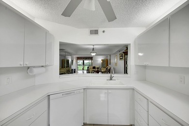 Step into this beautifully updated 55+ condo and immediately on Boca Dunes Golf and Country Club in Florida - for sale on GolfHomes.com, golf home, golf lot