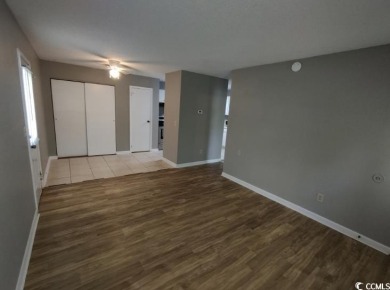 Two Bedroom, one and one half bath unit across the street from on The Hackler Course at Coastal Carolina University in South Carolina - for sale on GolfHomes.com, golf home, golf lot