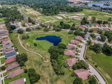 Best value in the neighborhood with easy, LOW-MAINTENANCE living on Meadow Oaks Golf and Country Club in Florida - for sale on GolfHomes.com, golf home, golf lot
