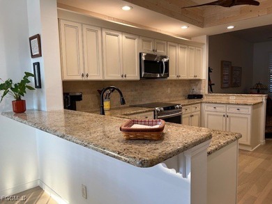 WELCOME TO YOUR NEW HOME with PEACEFUL AND SPECTACULAR LAKE & on Eagle Ridge Golf and Tennis Club in Florida - for sale on GolfHomes.com, golf home, golf lot