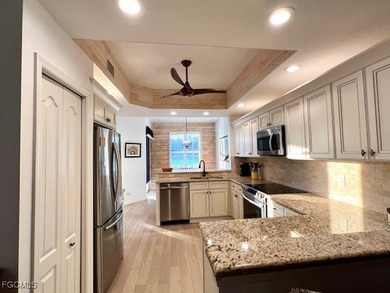 WELCOME TO YOUR NEW HOME with PEACEFUL AND SPECTACULAR LAKE & on Eagle Ridge Golf and Tennis Club in Florida - for sale on GolfHomes.com, golf home, golf lot