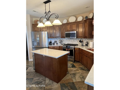 After driving past the picturesque stables and horses and on Rarity Bay Country Club - Loudon in Tennessee - for sale on GolfHomes.com, golf home, golf lot