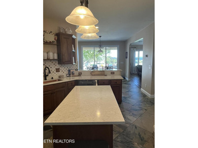 After driving past the picturesque stables and horses and on Rarity Bay Country Club - Loudon in Tennessee - for sale on GolfHomes.com, golf home, golf lot