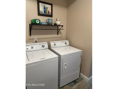 After driving past the picturesque stables and horses and on Rarity Bay Country Club - Loudon in Tennessee - for sale on GolfHomes.com, golf home, golf lot