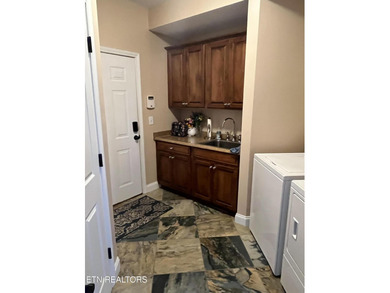 After driving past the picturesque stables and horses and on Rarity Bay Country Club - Loudon in Tennessee - for sale on GolfHomes.com, golf home, golf lot