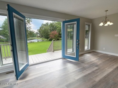 Welcome to 211 Country Club Road--a one-of-a-kind A-frame on Rock Creek Country Club in North Carolina - for sale on GolfHomes.com, golf home, golf lot