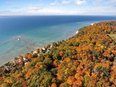 Discover the charm and serenity of lakeside living in this newly on Harbor Point Golf Club in Michigan - for sale on GolfHomes.com, golf home, golf lot